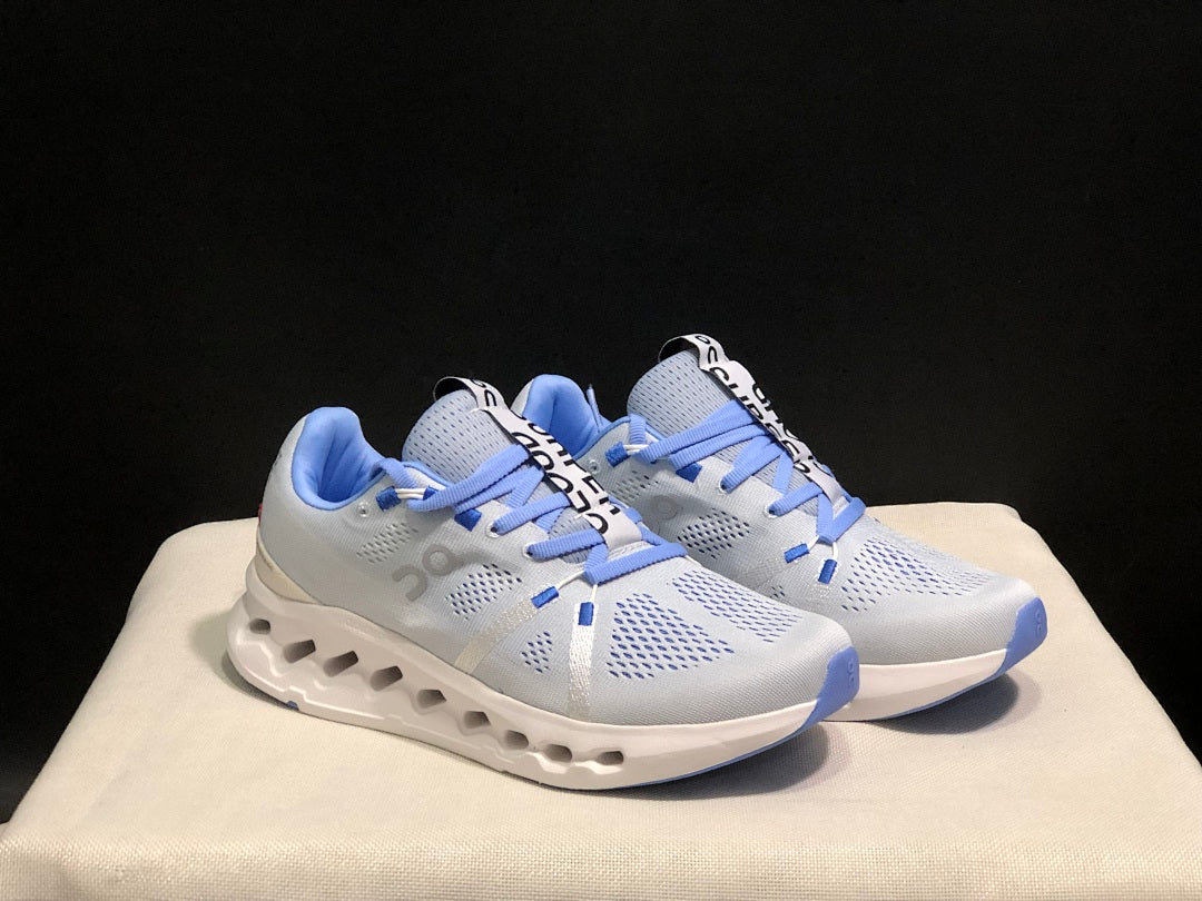 On Cloudsurfer Running Shoes, Heather in White and Blue - product image from the listing.
