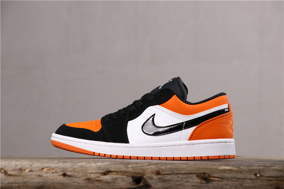 Air Jordan 1 Low Black White Orange Sneakers 553558-128 - product image from the listing.