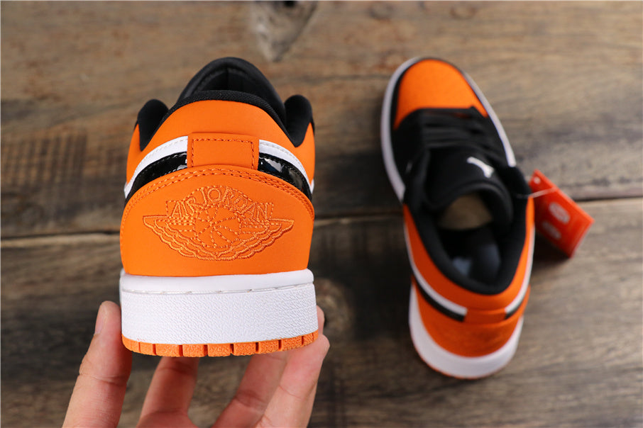 Air Jordan 1 Low Black White Orange Sneakers 553558-128 - product image from the listing.