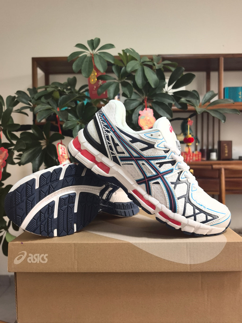 ASICS GEL-KAYANO 20 Running Sneakers in White and Blue - product image from the listing.