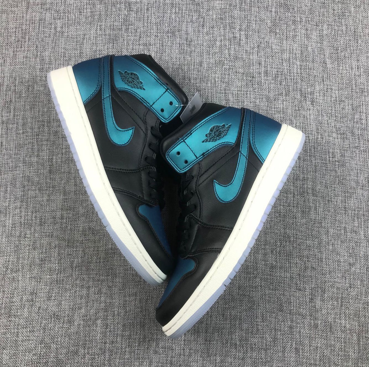 Air Jordan 1 Mid BQ6472-009 Sneakers in Black and Turquoise - product image from the listing.