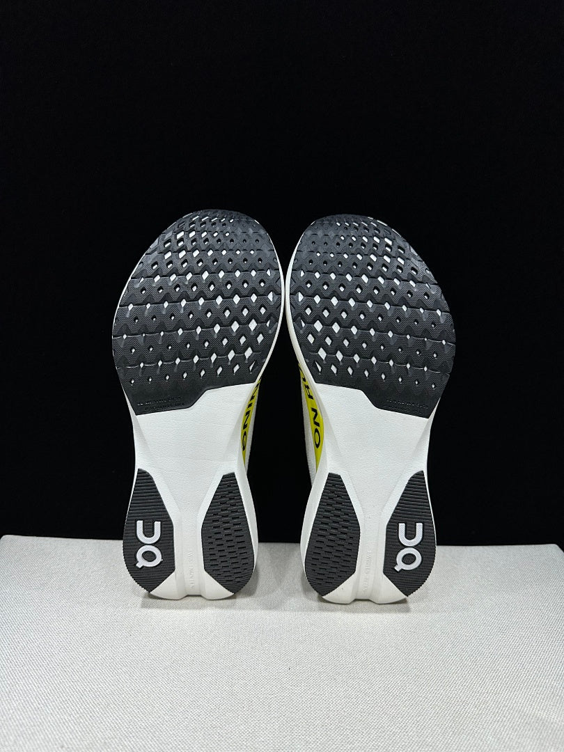 On Cloudboom Strike LS Running Shoes in White Lime - product image from the listing.