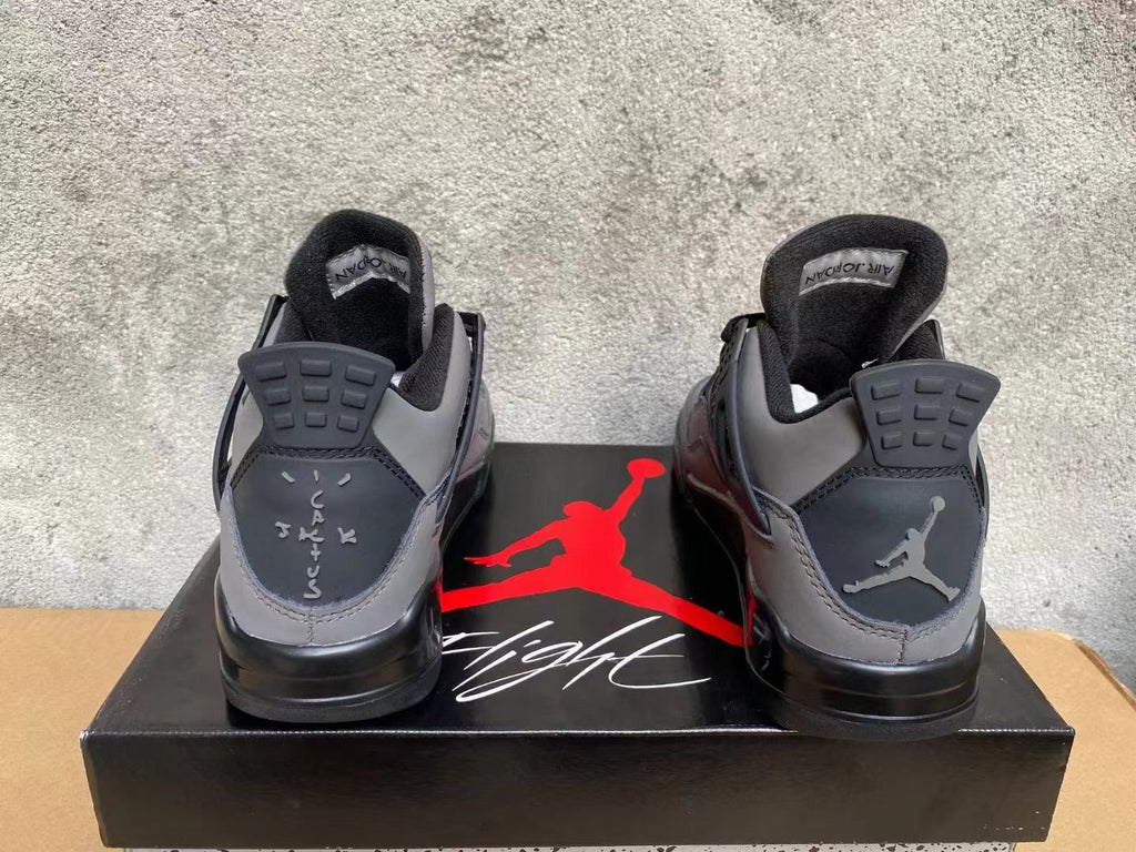 Air Jordan 4 Sneakers in Grey & Black - product image from the listing.