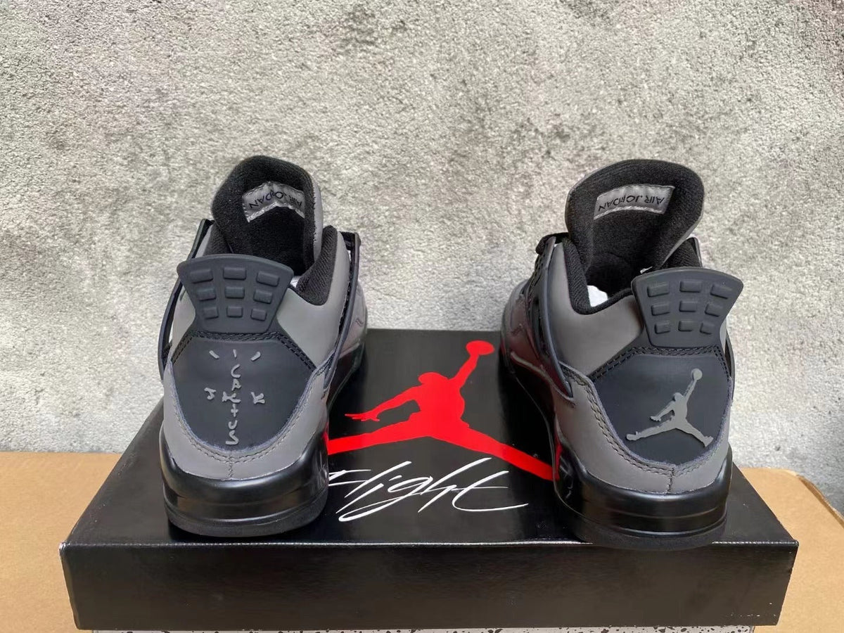 Air Jordan 4 Sneakers in Grey & Black - product image from the listing.