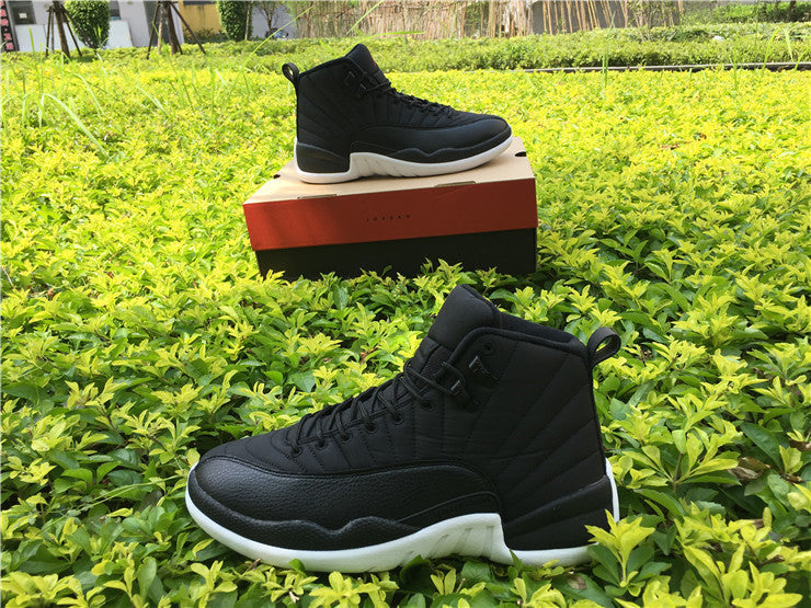 Air Jordan 12 Black Nylon High-Top Sneakers - product image from the listing.