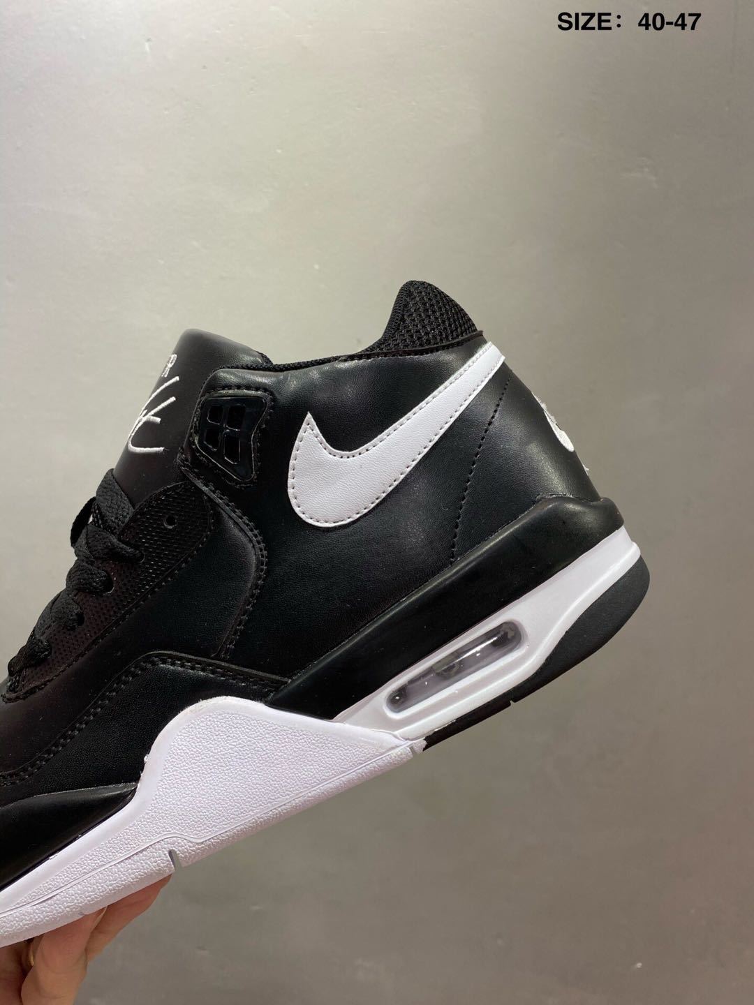 Nike Air Flight 89 Sneakers in Black and White - product image from the listing.