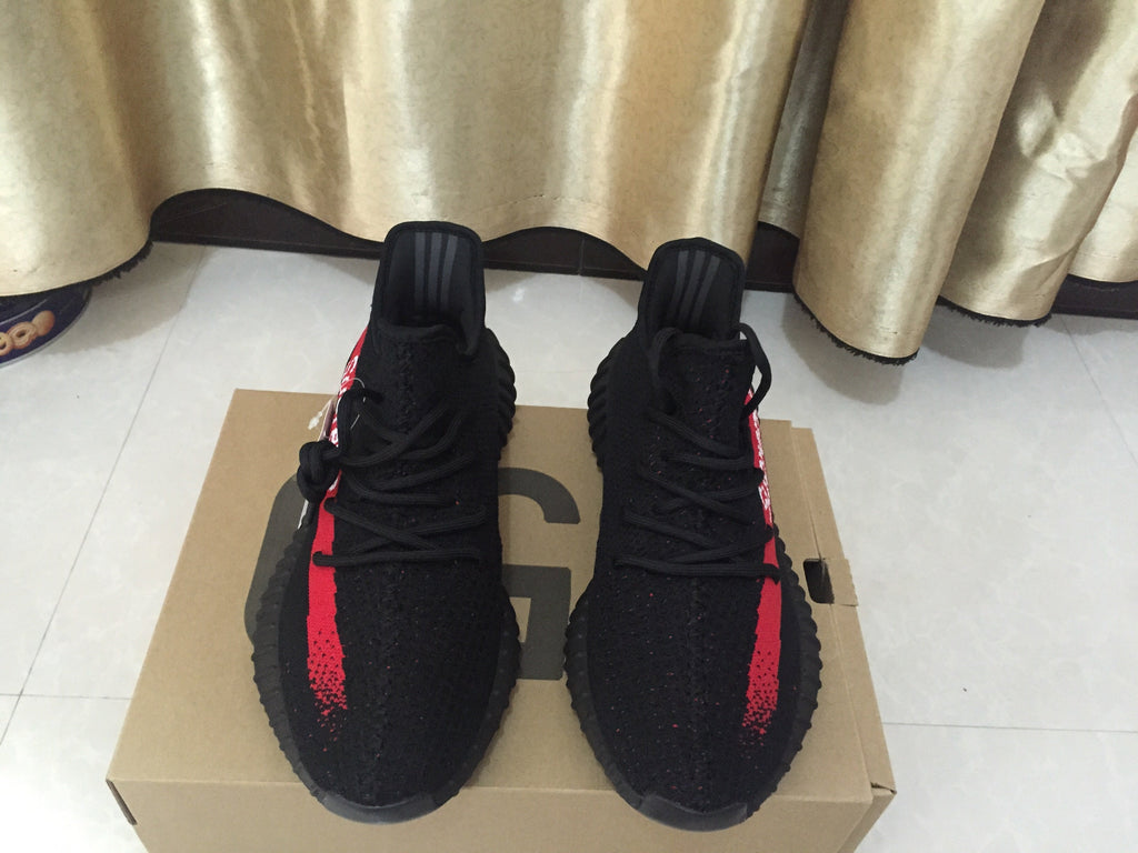 Yeezy 350 V2 Sneakers in Black and Red Knit - product image from the listing.