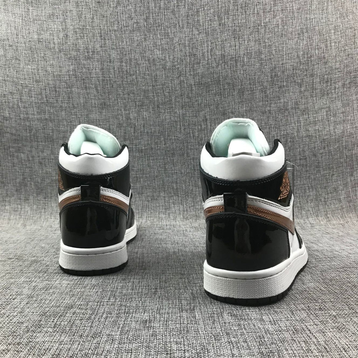 Air Jordan 1 Mid Sneakers in Black White Metallic Gold 852542-007 - product image from the listing.