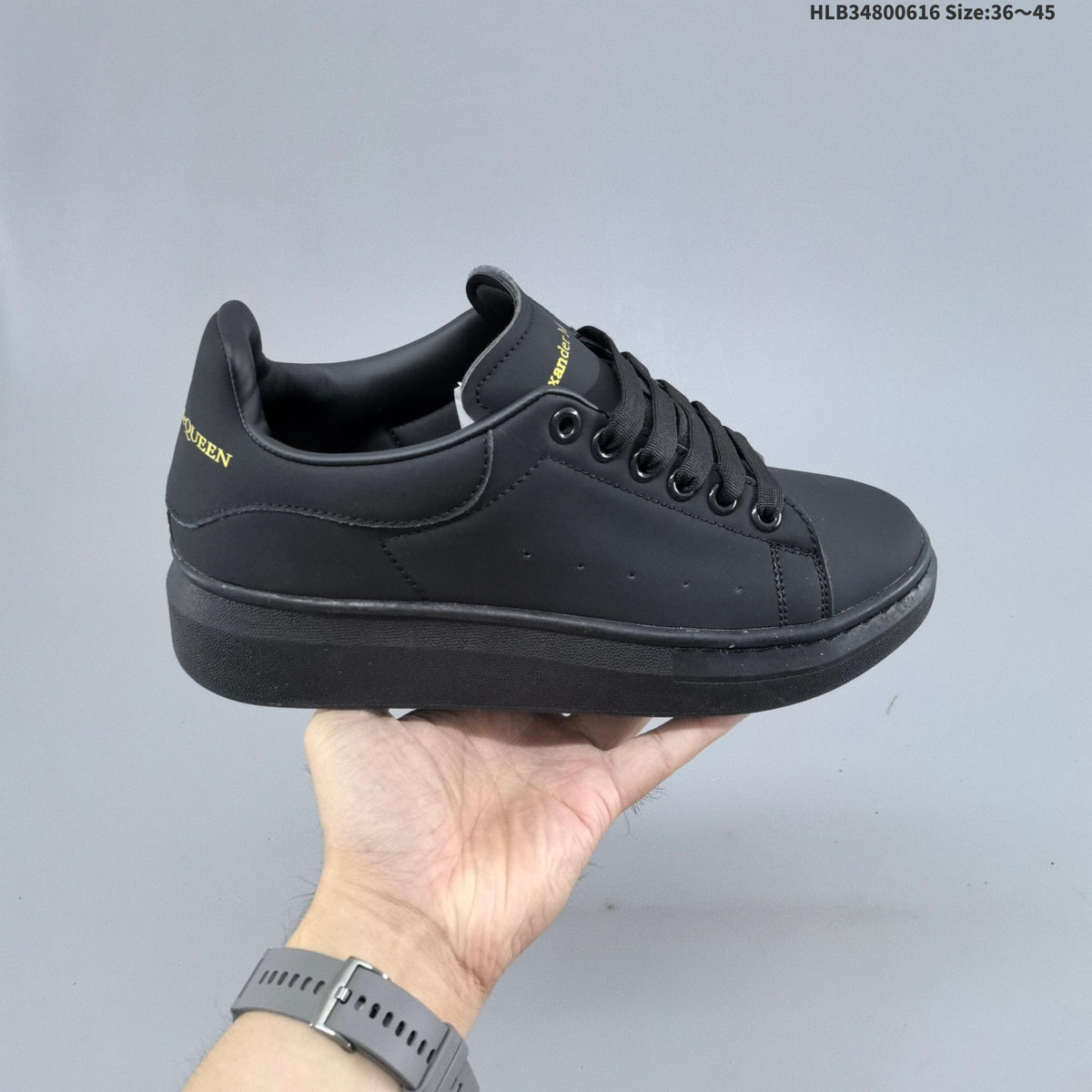 Alexander McQueen Oversized Low-Top Sneakers, in White and Black - product image from the listing.