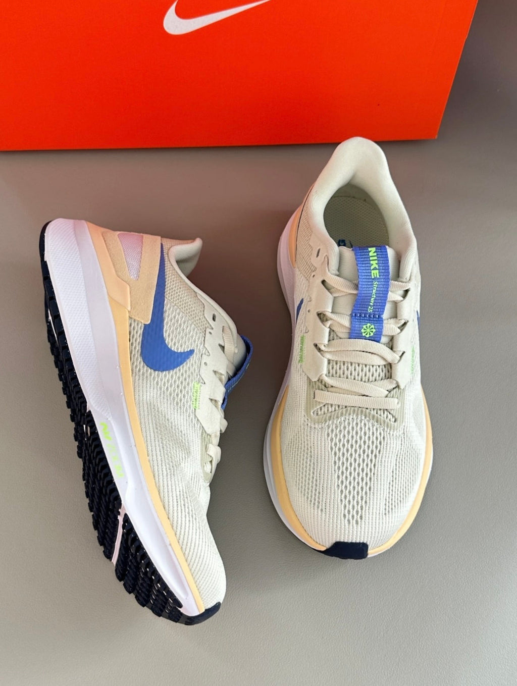 Nike Structure 25 Road Running Shoes DJ7884-004 in Beige - product image from the listing.