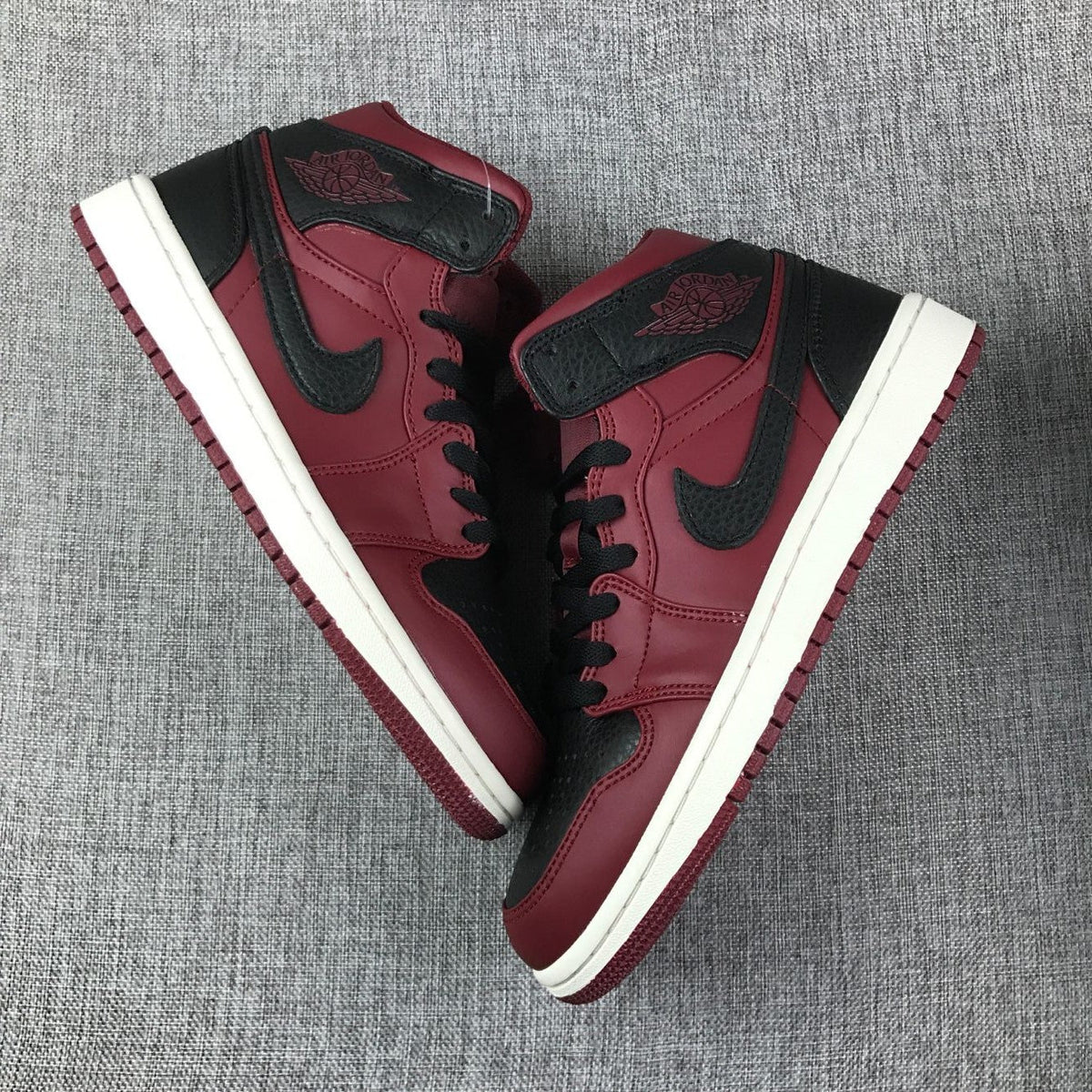 Air Jordan 1 Mid High-Top Sneakers in Burgundy and Black - product image from the listing.