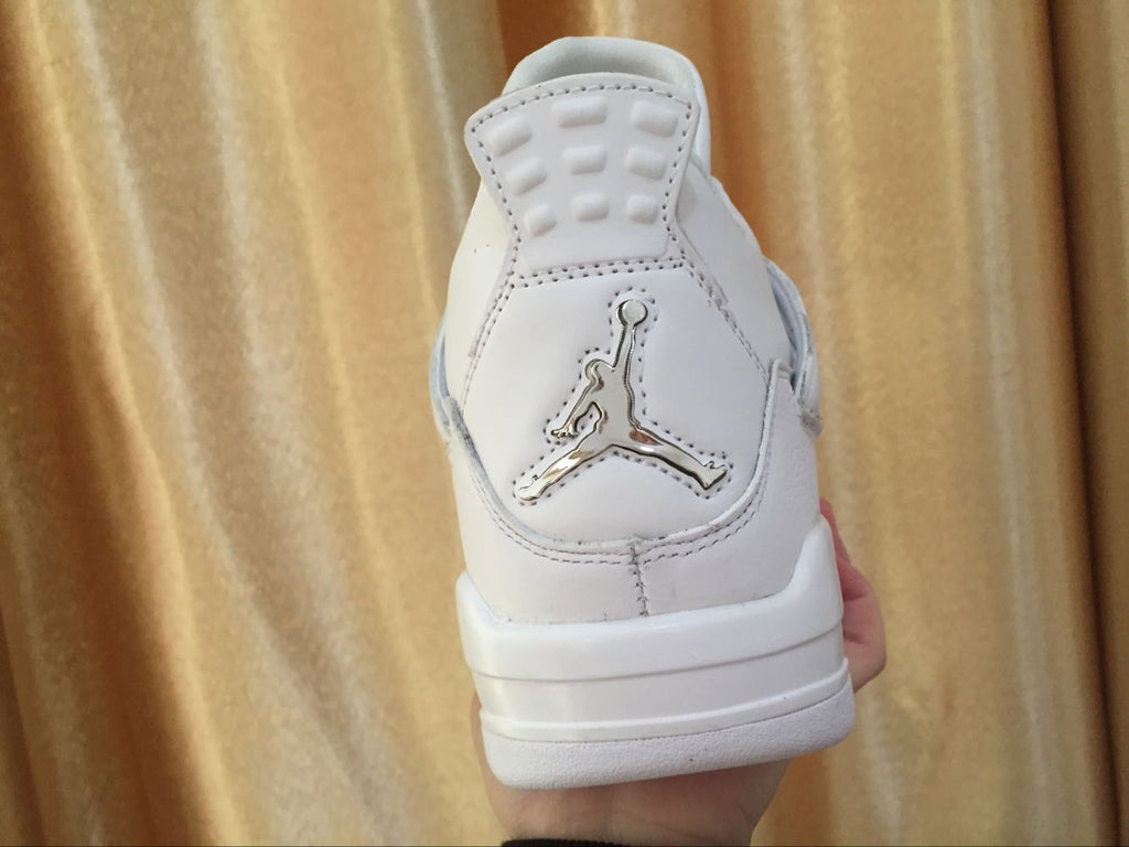 Air Jordan 4 Retro White High-Top Sneakers - product image from the listing.