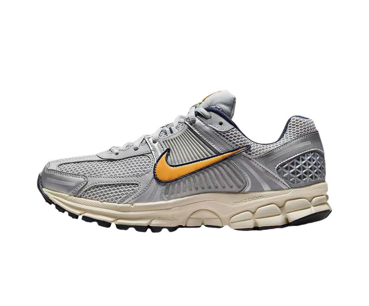 Nike Zoom Vomero 5 Sneakers in Gray Orange - product image from the listing.