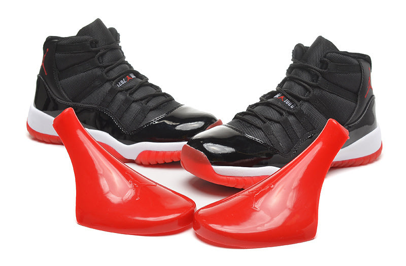 Air Jordan 11 Retro High Basketball Sneakers in Black Red - product image from the listing.