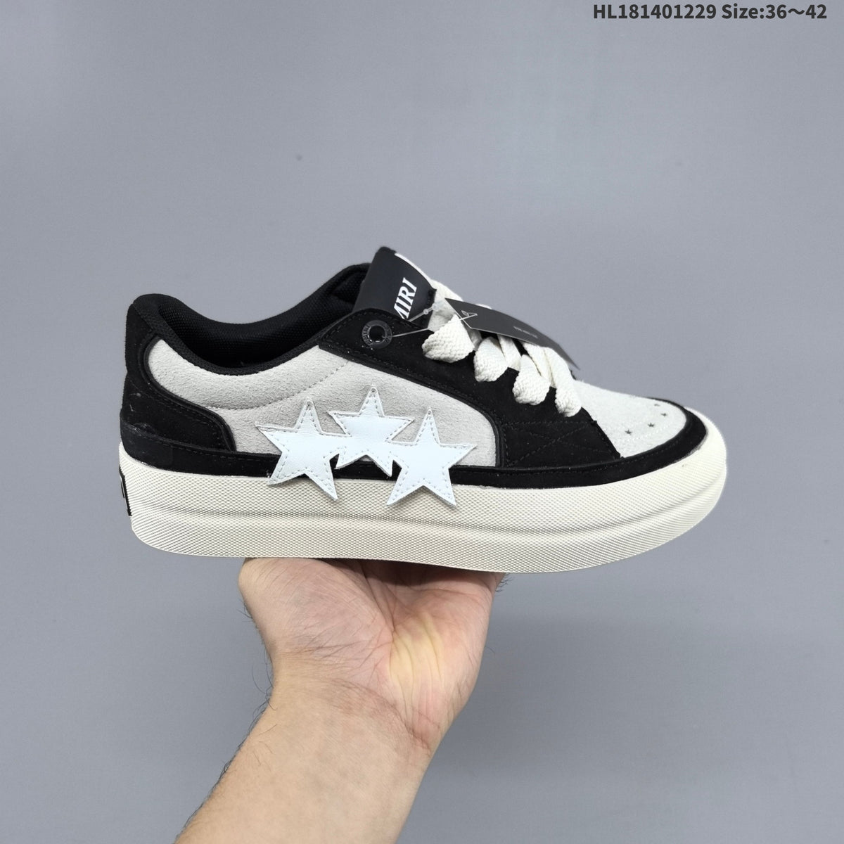 AMIRI Star Low-Cut Sneakers with Leopard Print Details - product image from the listing.