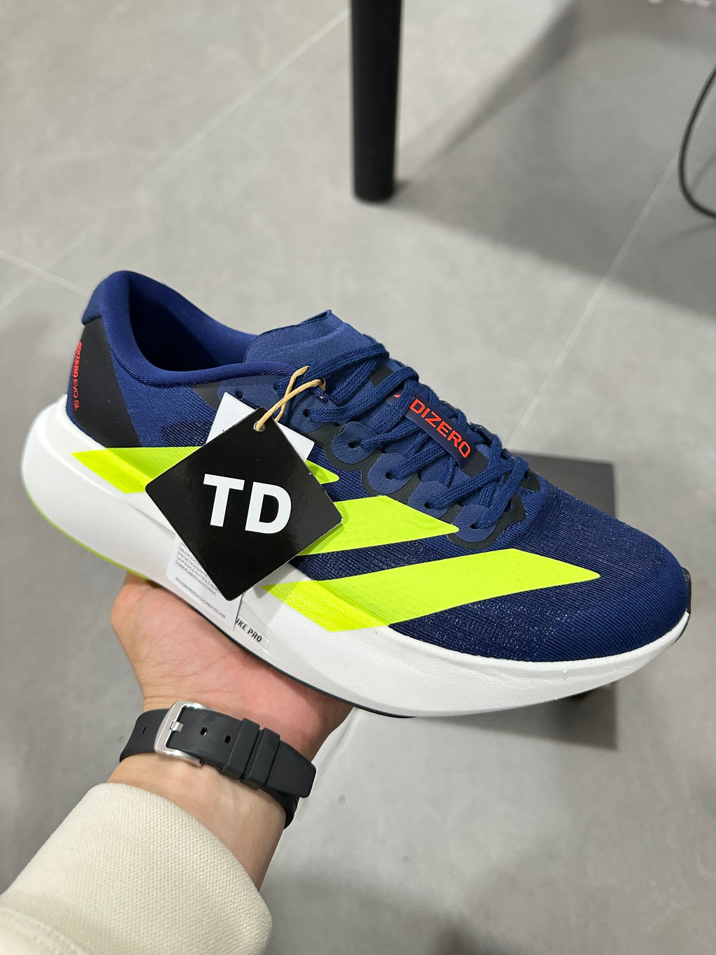 Adidas Lightstrike Pro Running Shoes in Navy Volt - product image from the listing.