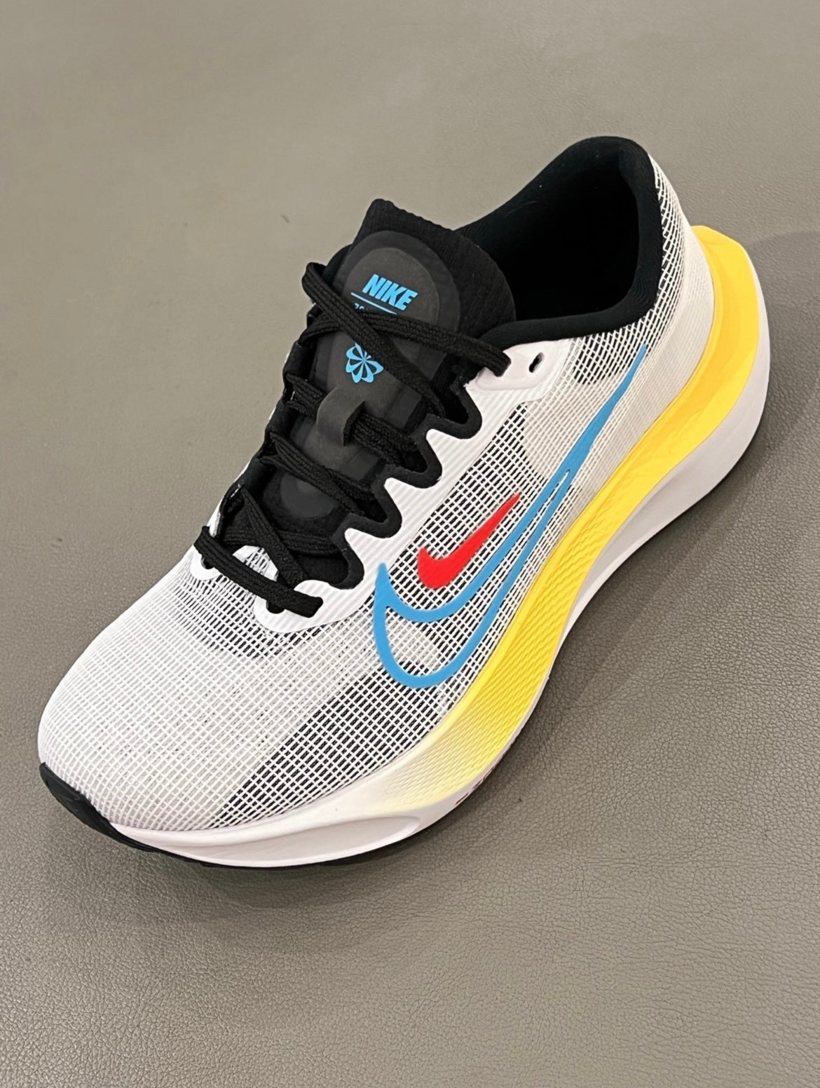 Nike Zoom Fly 5 Running Shoes in White Yellow Blue DM8974-002 - product image from the listing.