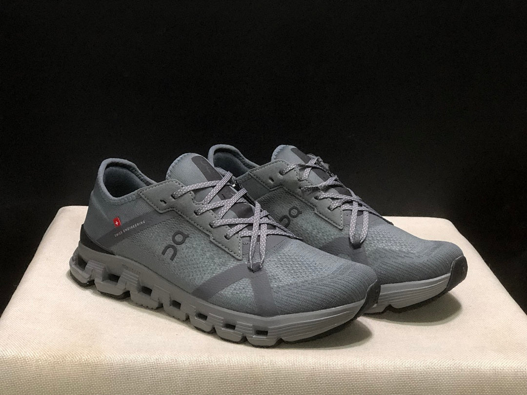 Gray and Black On Cloud X 4 AD Sneakers - product image from the listing.