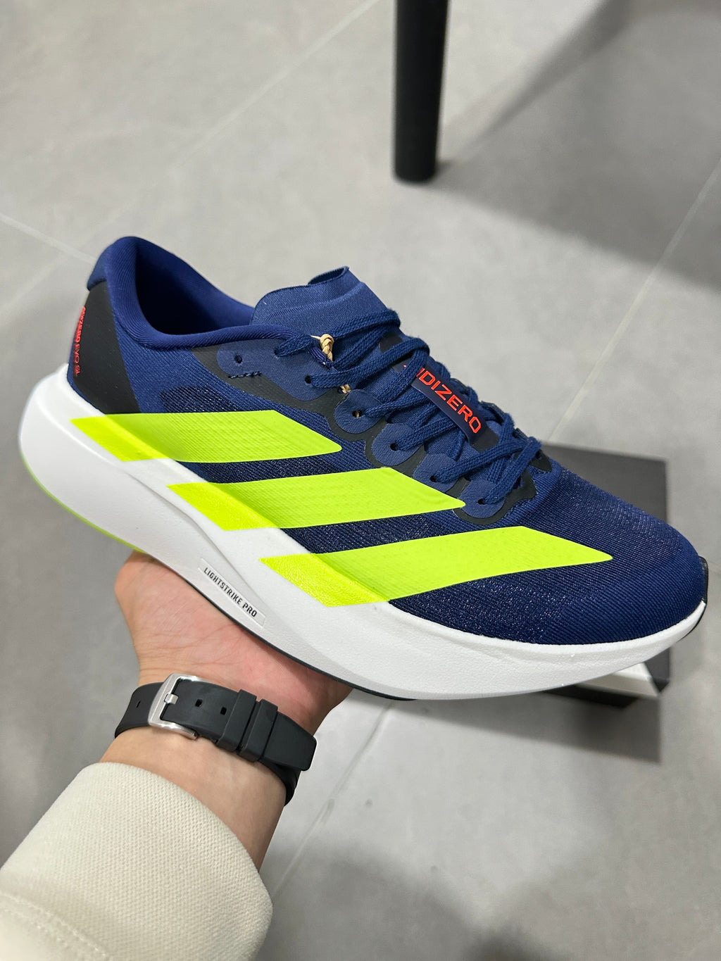 Adidas Lightstrike Pro Running Shoes in Navy Volt - product image from the listing.