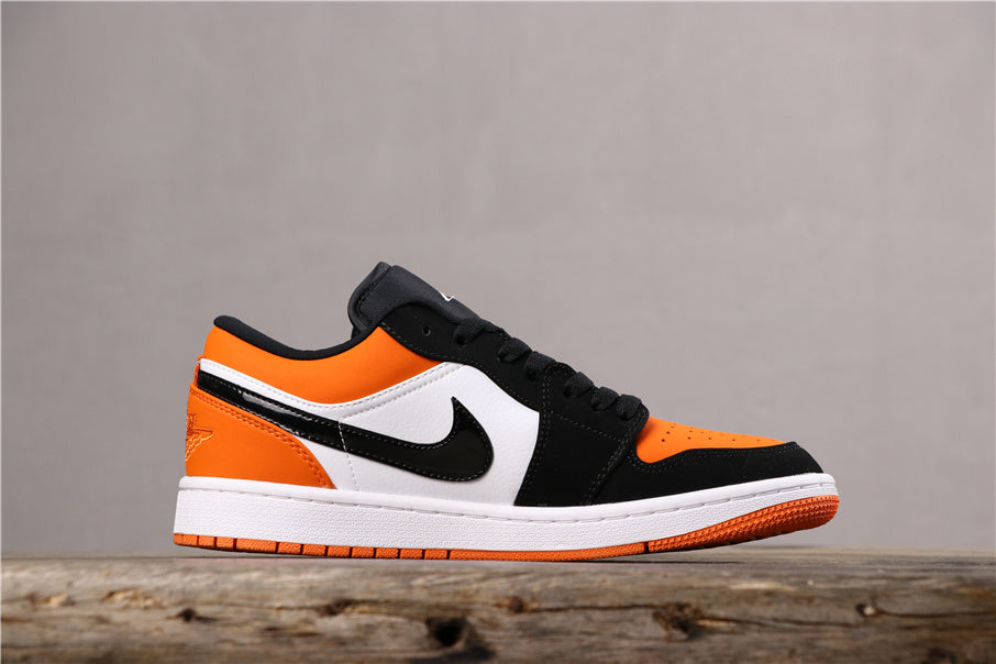 Air Jordan 1 Low Black White Orange Sneakers 553558-128 - product image from the listing.