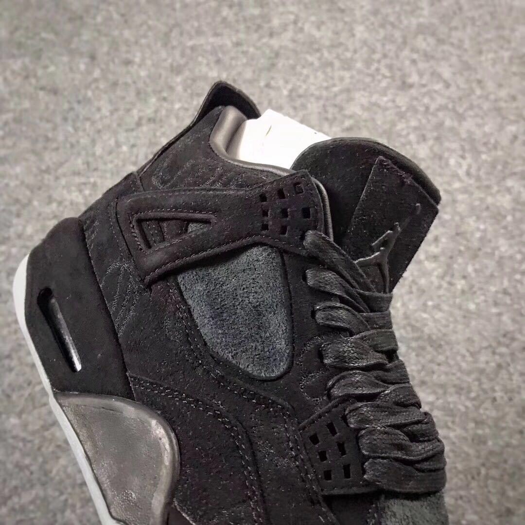 Jordan 4 KAWS Graffiti High-Top Sneakers in Black - product image from the listing.