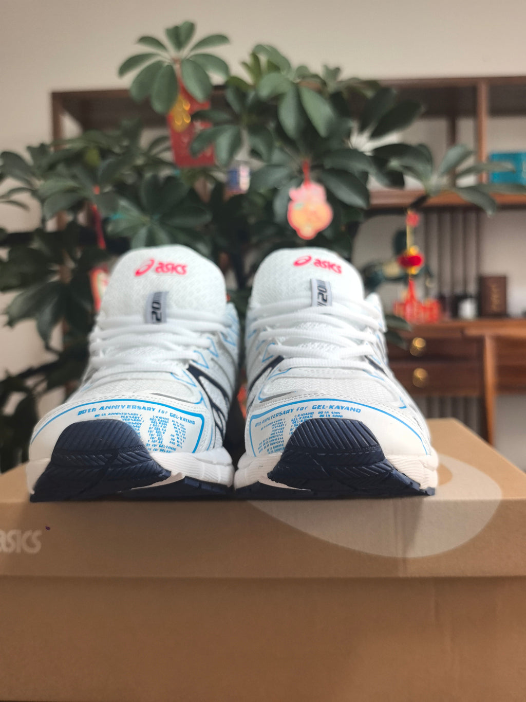ASICS GEL-KAYANO 20 Running Sneakers in White and Blue - product image from the listing.