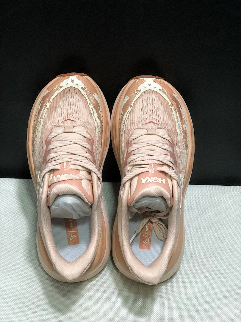 HOKA Stinson 7 Trail Running Shoes in Blush and in Cream - product image from the listing.