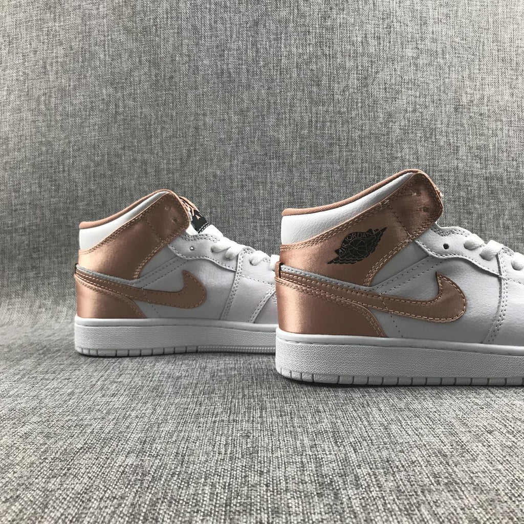 Women's Jordan 1 Mid Rose Gold Silk Sneakers 555112-190 - product image from the listing.