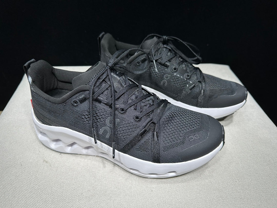 On Cloudsurfer Trail Trail Running Shoes in Black and White - product image from the listing.