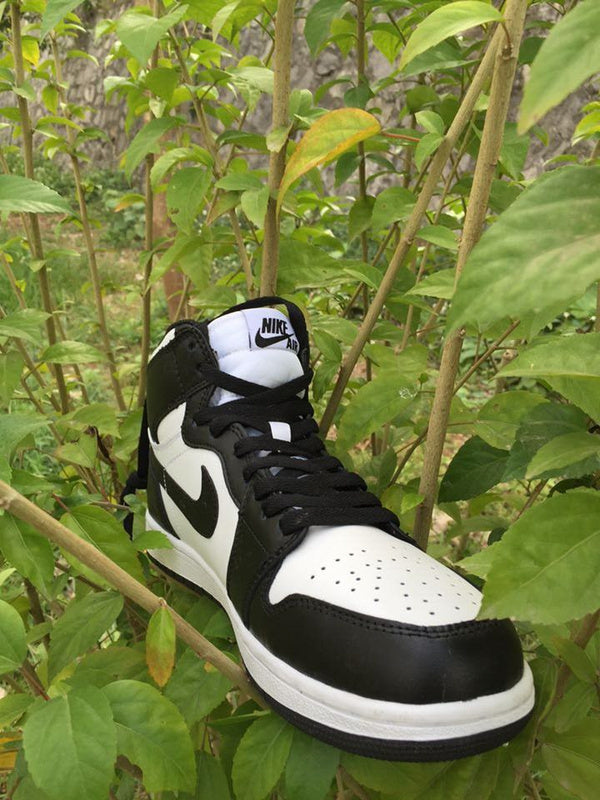 Jordan 1 High Sneakers in Black and White - product image from the listing.