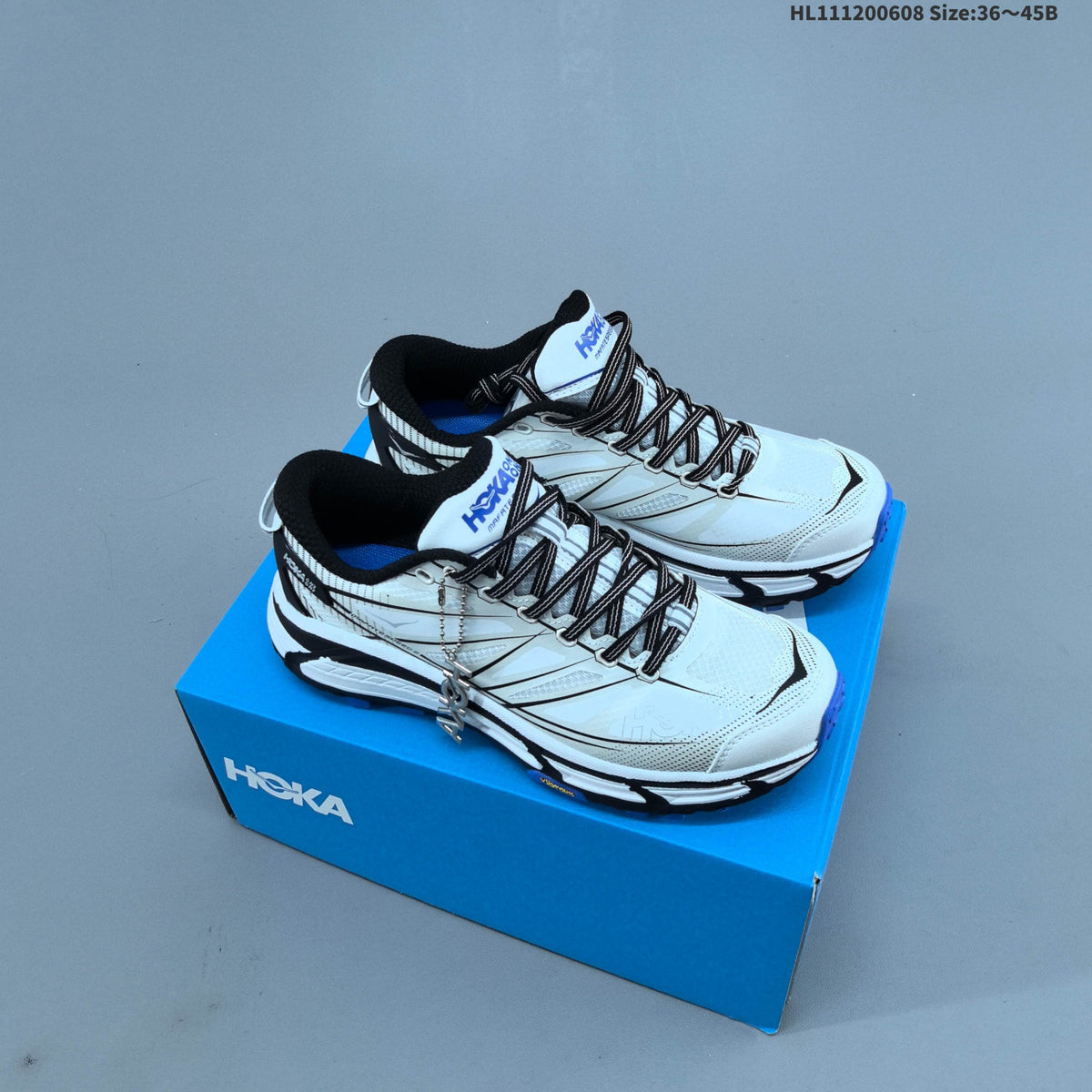 HOKA Mafate Speed 2 Low Trail Running Shoes, in White Black Blue - product image from the listing.