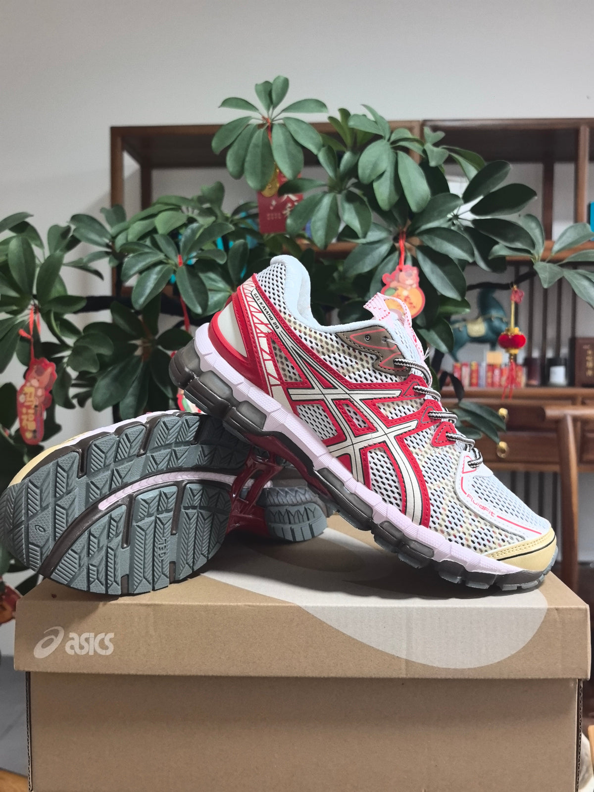 ASICS Gel-Kayano 22 Running Sneakers in White and Red - product image from the listing.