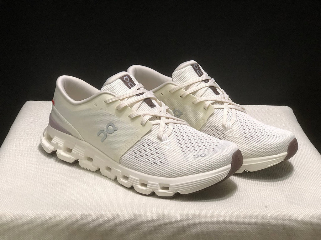 On Cloud X 4 Running Sneakers in Ivory - product image from the listing.