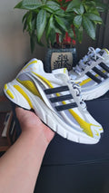 White and Yellow Mesh Trainers with Black Side Stripes - product image from the listing.