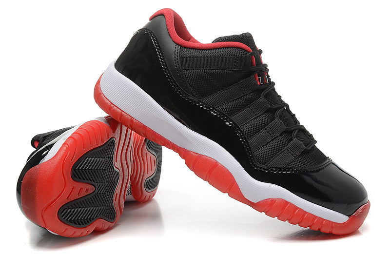 Air Jordan 11 Retro Low Black Red Sneakers - product image from the listing.