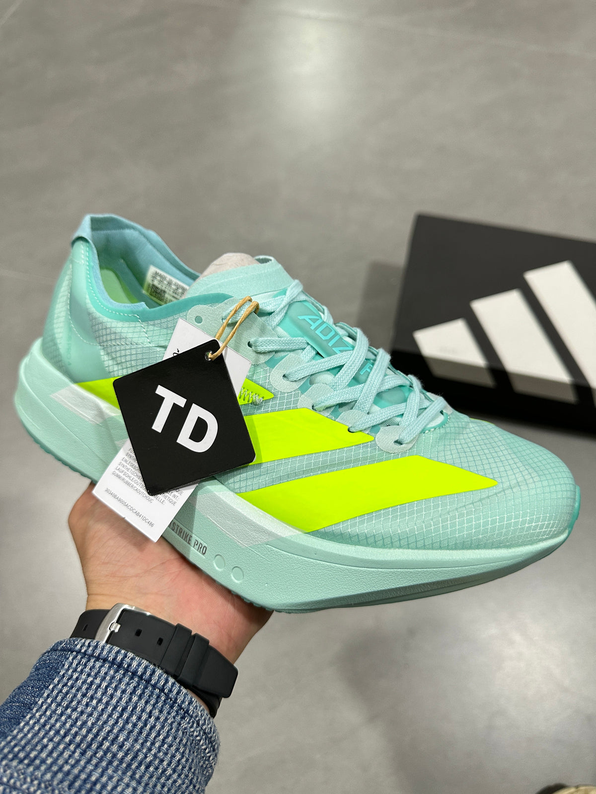 Nike Lightstrike Pro Running Shoes, in Mint Green and Volt - product image from the listing.