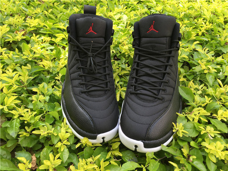 Air Jordan 12 Black Nylon High-Top Sneakers - product image from the listing.