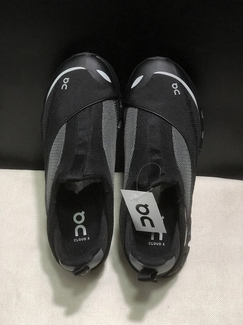On Cloud 4 Coast Black Slip-On Trainers - product image from the listing.