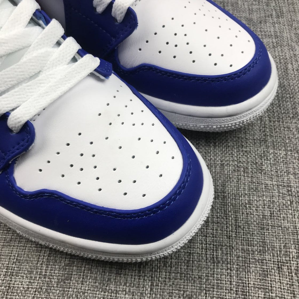 Air Jordan 1 Mid Sneakers in Blue Pink 554724-451 - product image from the listing.