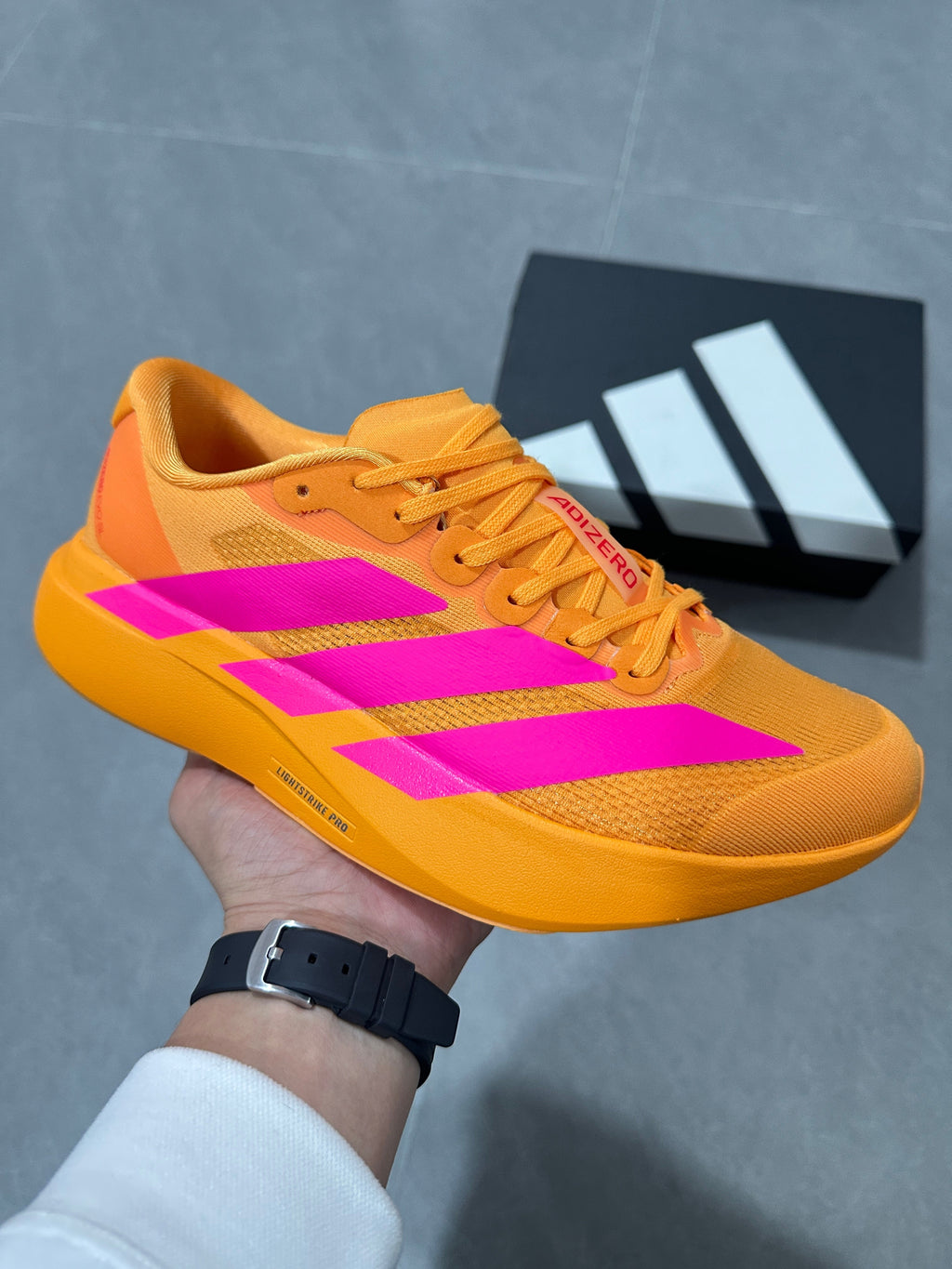 adidas Adizero Lightstrike Pro Running Shoes in Gold Pink - product image from the listing.
