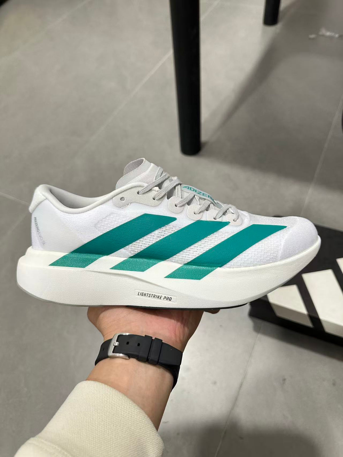 adidas Lightstrike Pro Running Shoes in White and Teal JR4451 - product image from the listing.