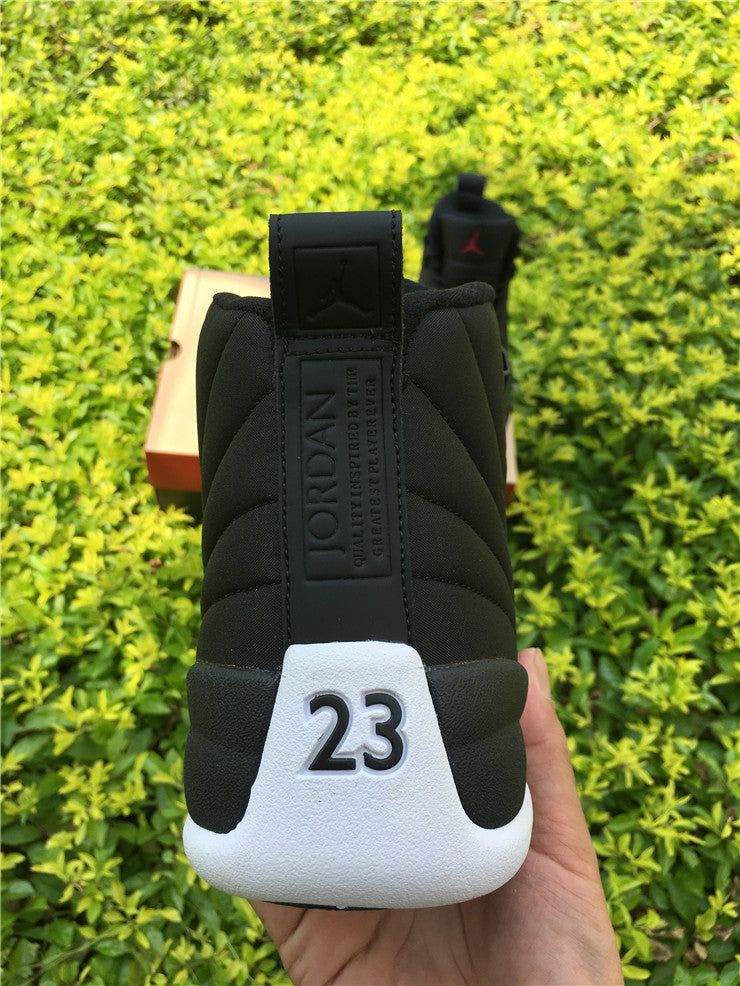 Air Jordan 12 Black Nylon High-Top Sneakers - product image from the listing.