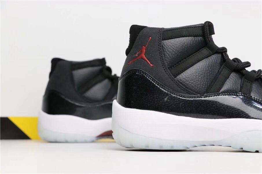 Air Jordan 11 Retro 72-10 High-Top Sneakers in Black and White - product image from the listing.
