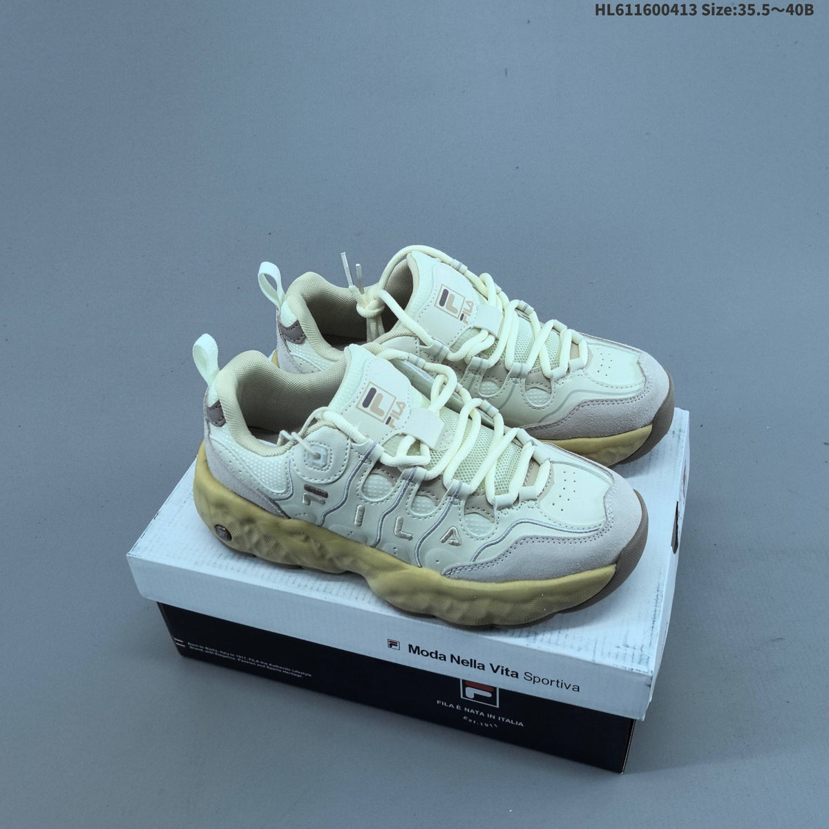 Cream and Charcoal FILA Chunky Sole Sneakers - product image from the listing.
