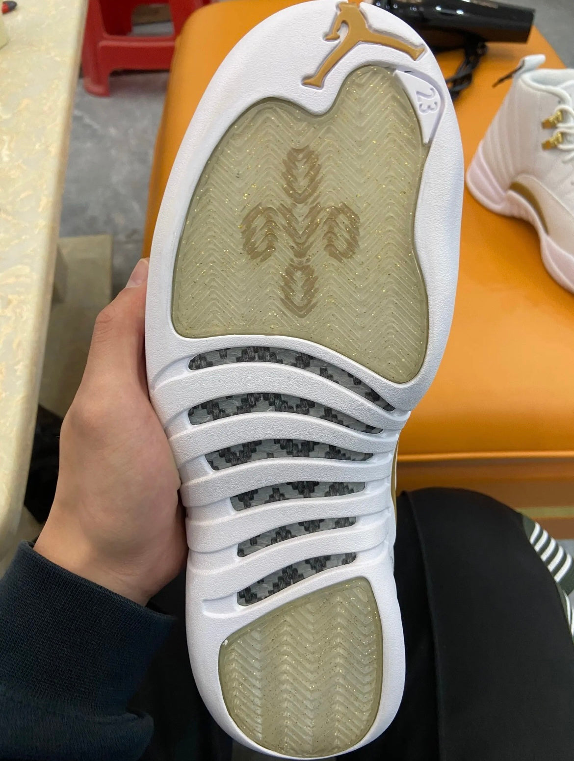 Air Jordan 12 OVO Sneakers in White 873864-102 - product image from the listing.
