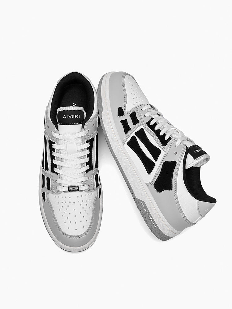 AMIRI Gray and White Low-Cut Sneakers with Black Accents - product image from the listing.
