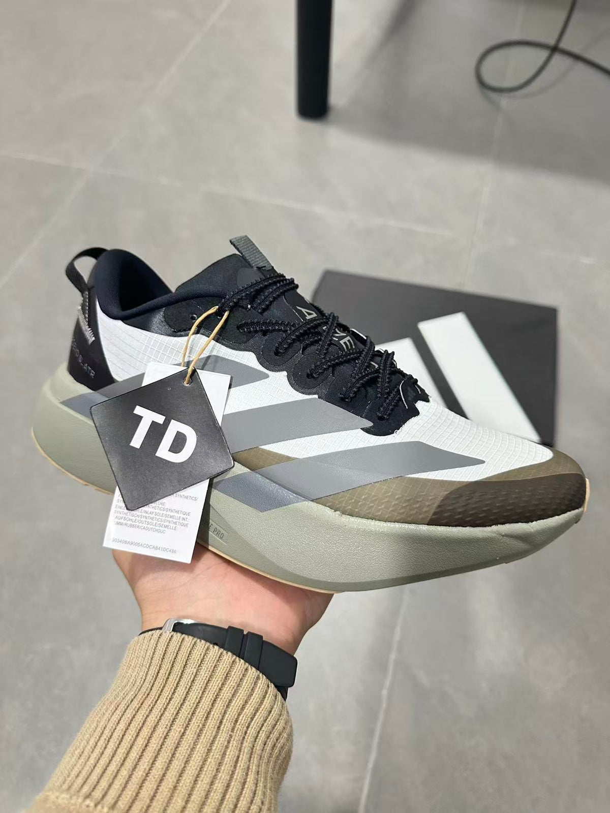 Black and White Adidas Adizero SL Running Shoes - product image from the listing.