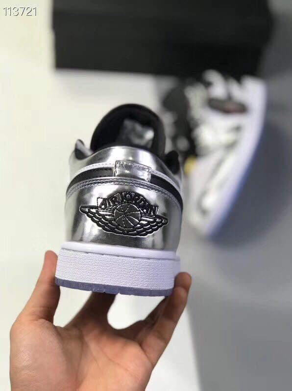 Jordan 1 Low Leonard Sneakers in Silver and White - product image from the listing.