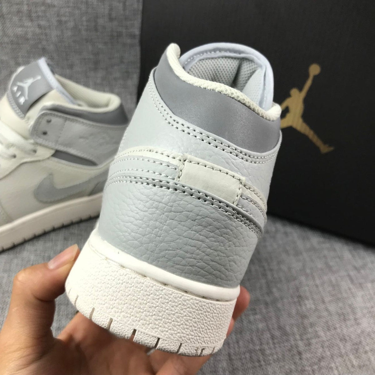 White and Grey Air Jordan 1 Mid Sneakers - product image from the listing.