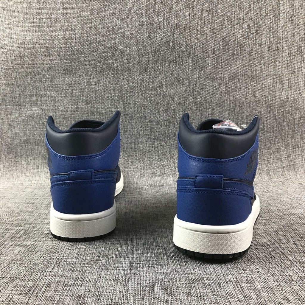 Air Jordan 1 Mid High-Top Sneakers in Black and Royal Blue - product image from the listing.